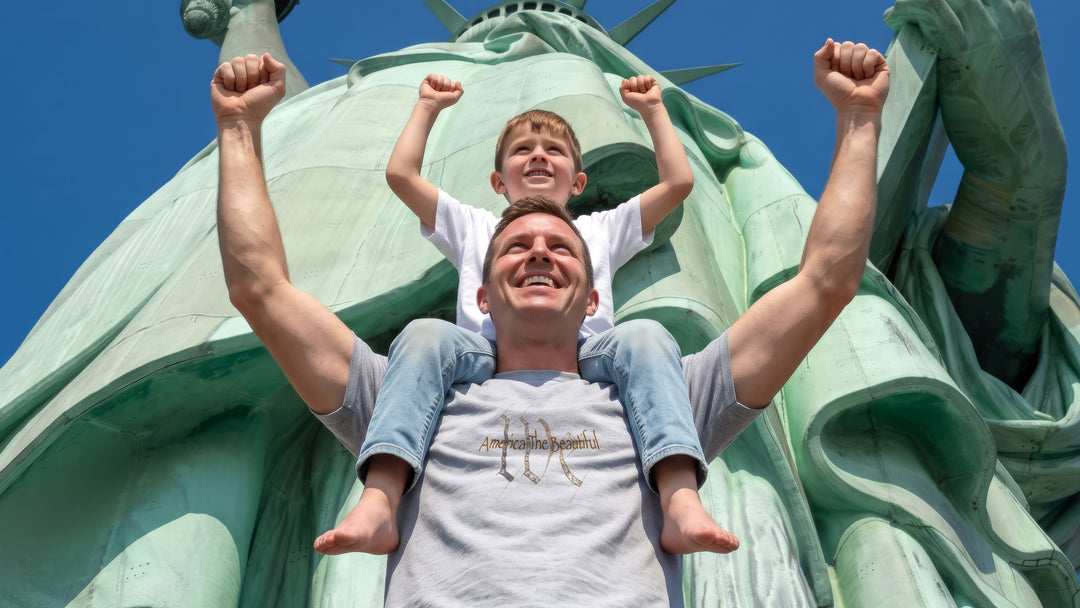 A man wearing a Gray t-shirt with "We" (the people) and  &