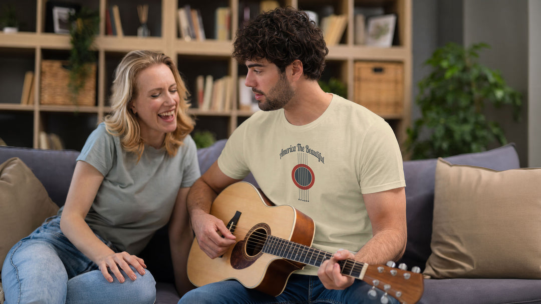 Cozy couple, man is wearing a Beige t-shirt with acoustic guitar graphic and &