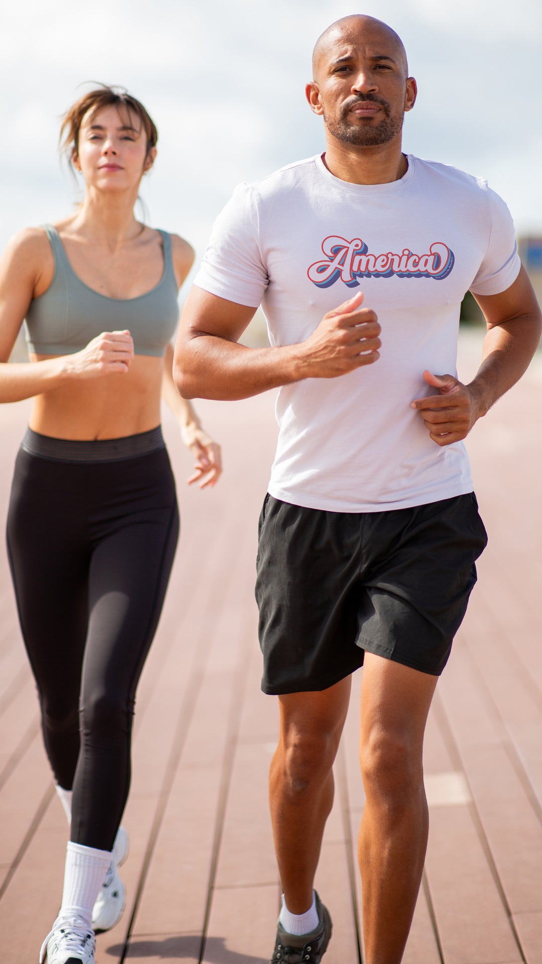 Man and woman running outdoors White t-shirt with &