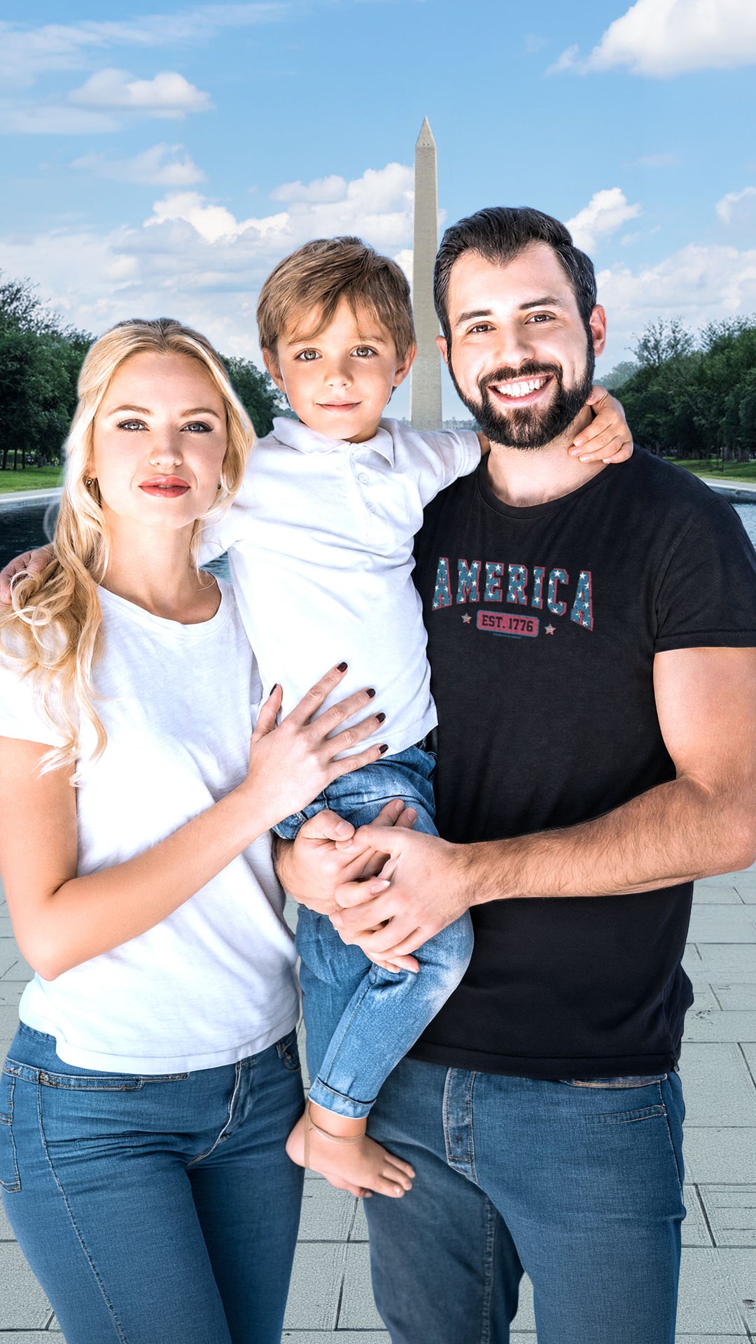 A family of four posing together in front of a Washington Monument backdrop. The father wears a Black t-shirt by America The Beautiful with &