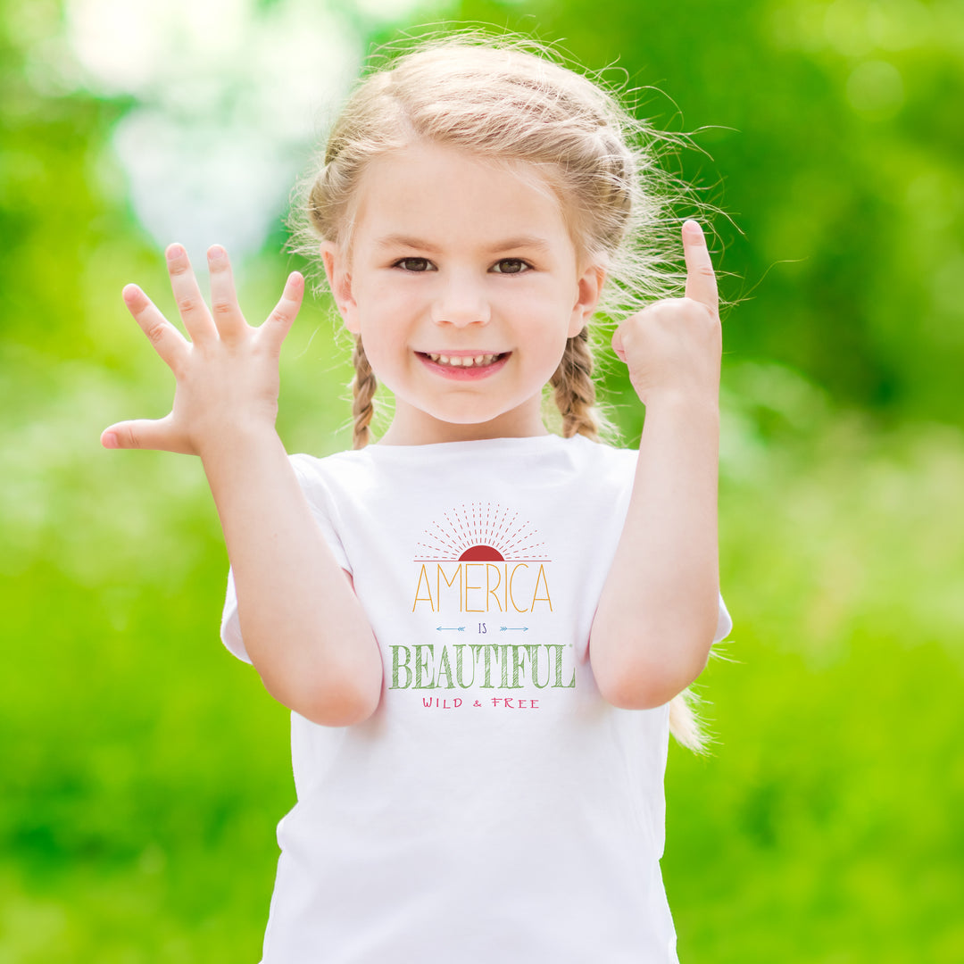 Young girl wearing a White t-shirt with &