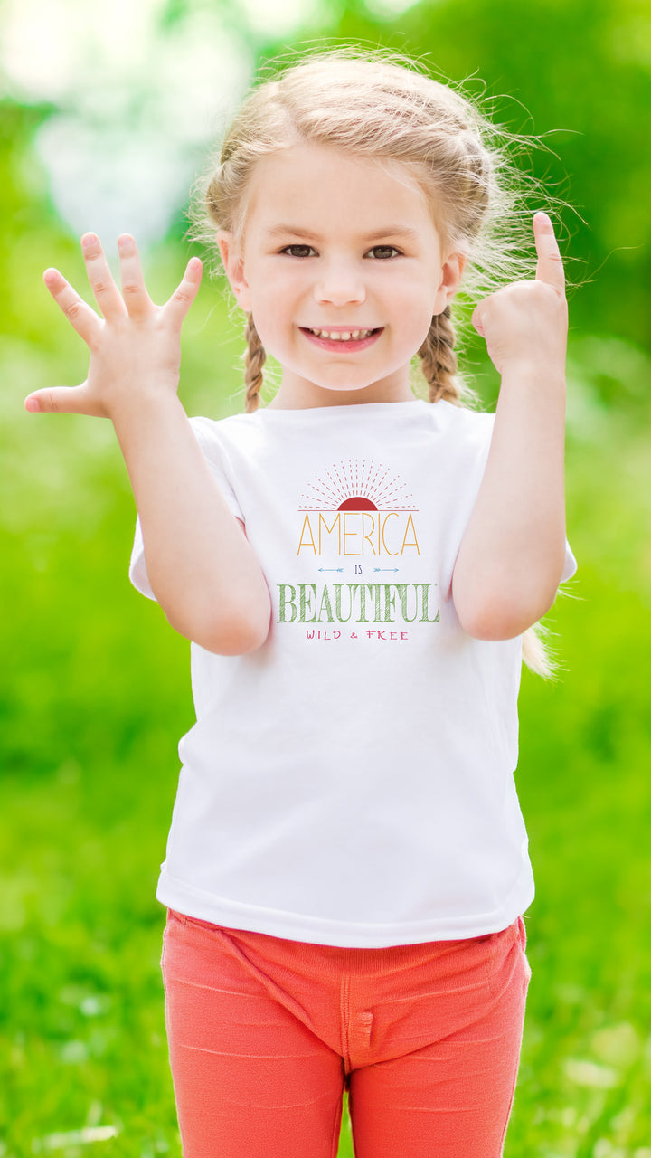 Young girl wearing a White t-shirt with &
