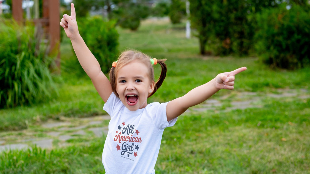 Smiling girl wearing a White t-shirt with &