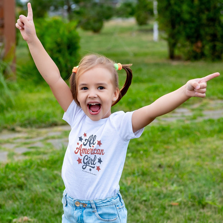 Smiling girl wearing a White t-shirt with &