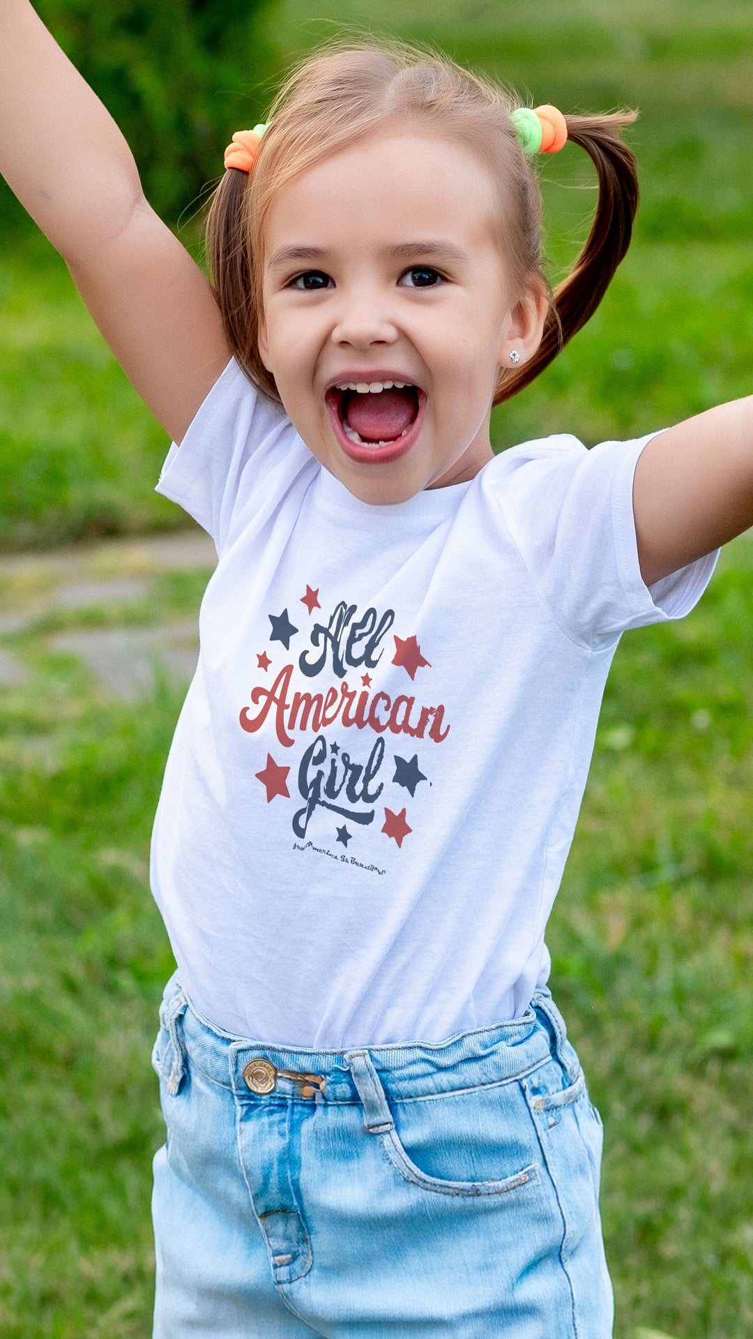 Smiling girl wearing a White t-shirt with &