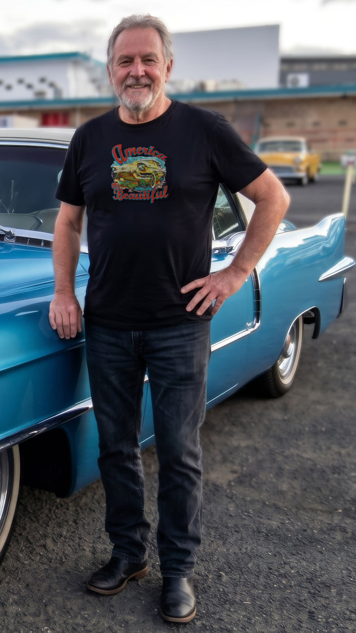 Man wearing a Black t-shirt with colorful graphic of vintage Cadillac and &