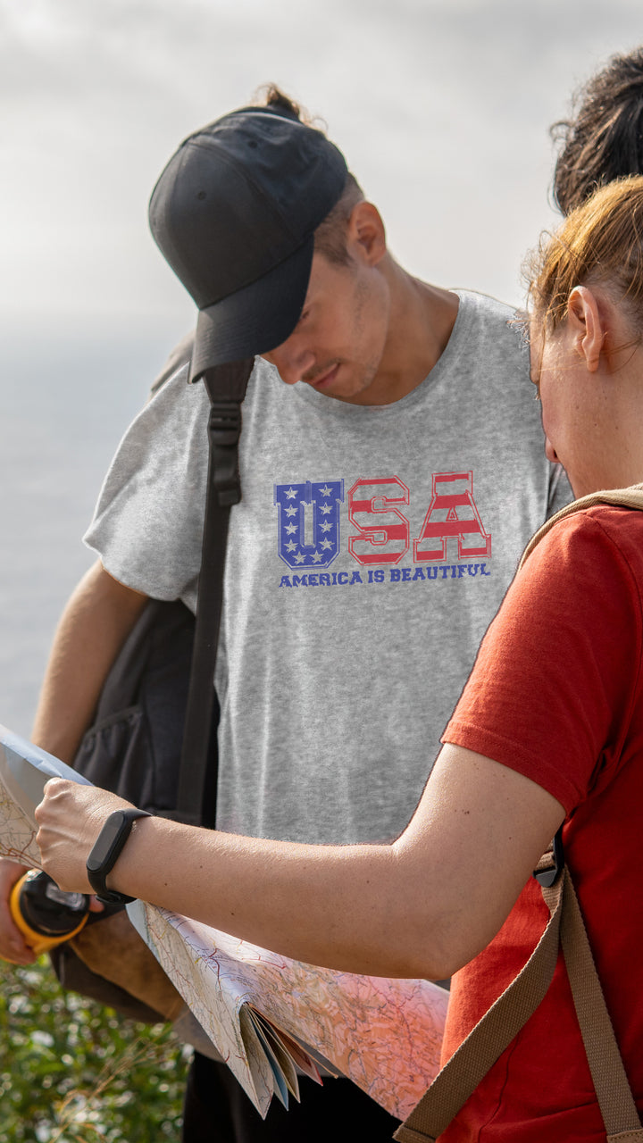 Two people outdoors, one wearing a gray t-shirt with &