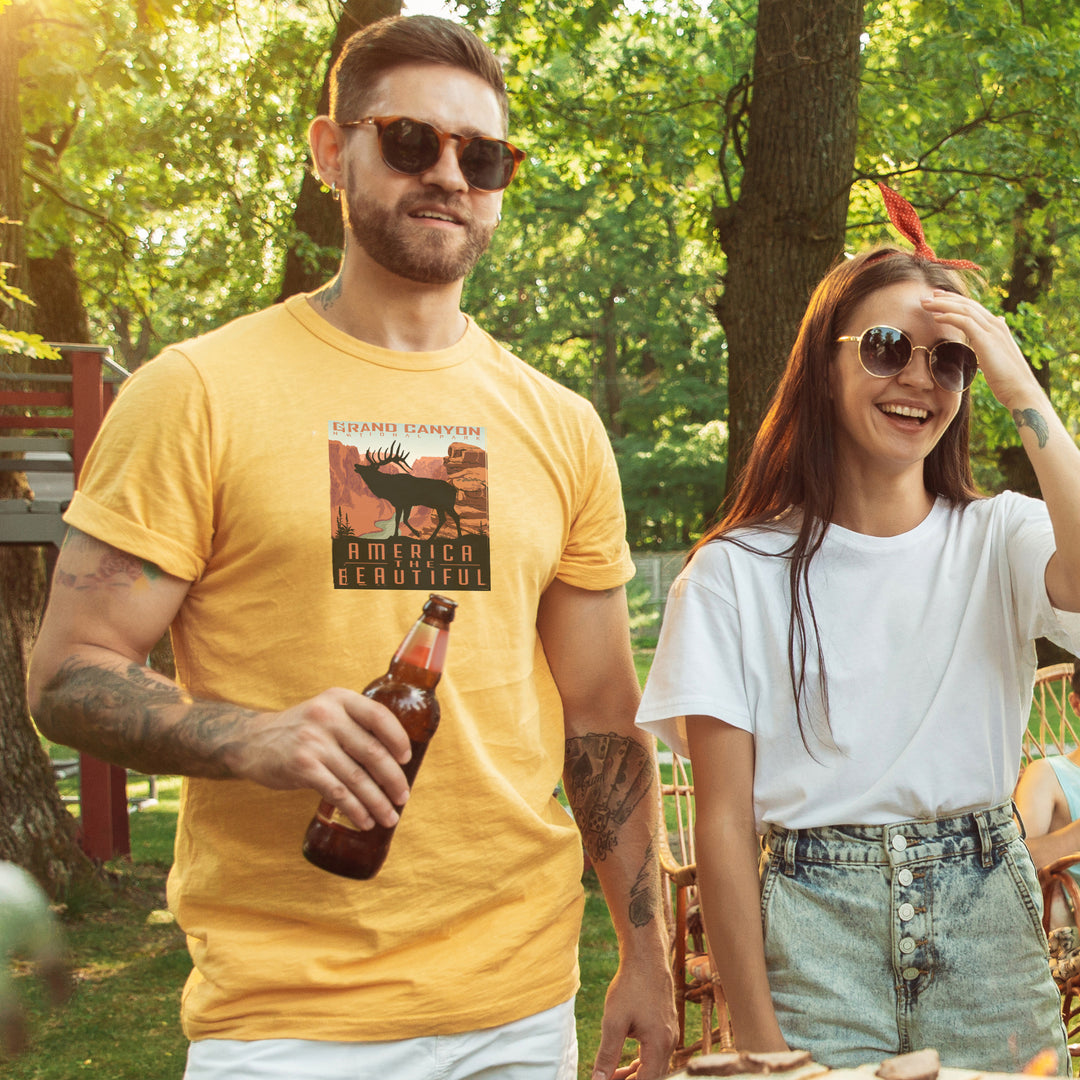 Man wearing a Yellow t-shirt with Grand Canyon Elk graphic and &