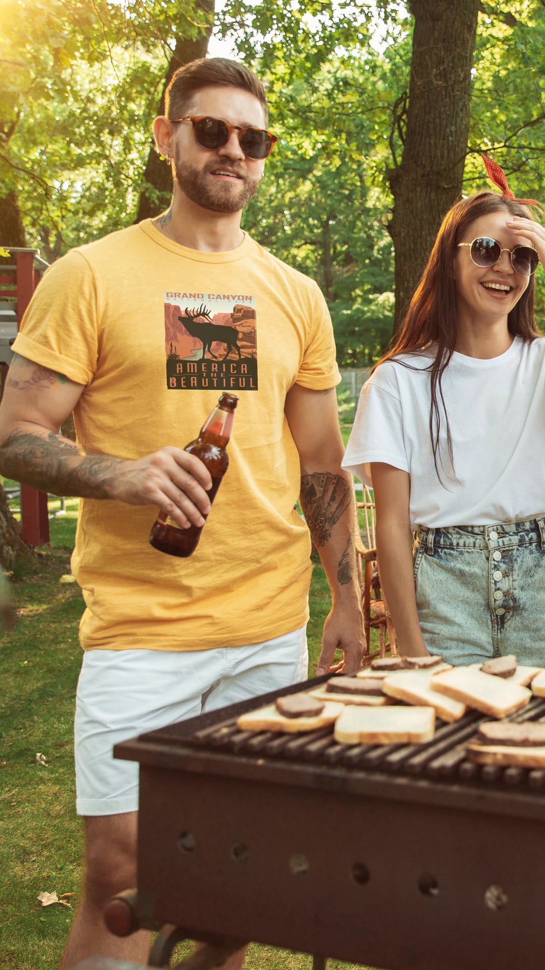 Man wearing a Yellow t-shirt with Grand Canyon Elk graphic and &