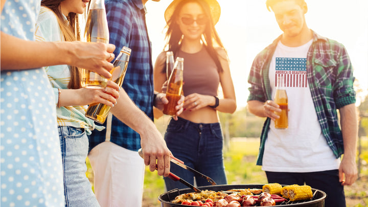 Group of friends with one wearing White t-shirt with American flag design and &