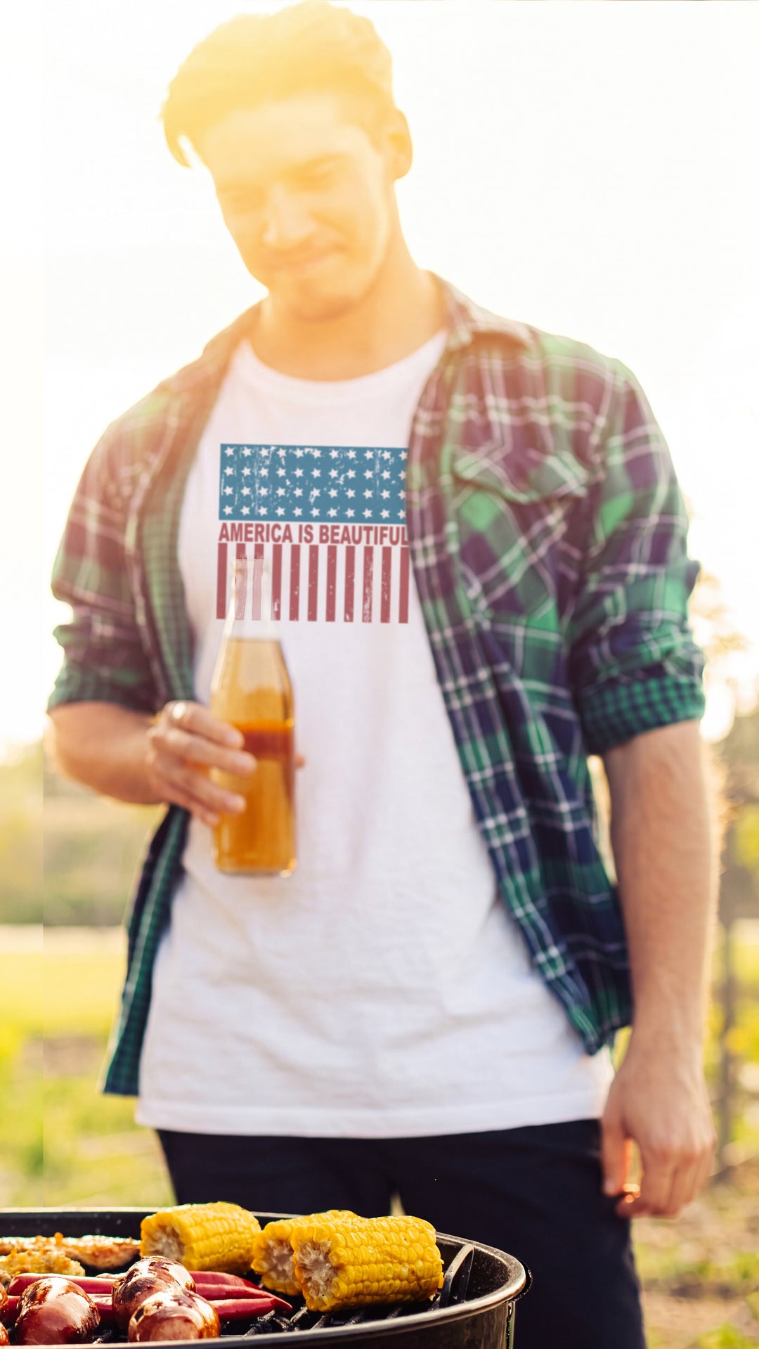 Young male wearing White t-shirt with American flag design and &