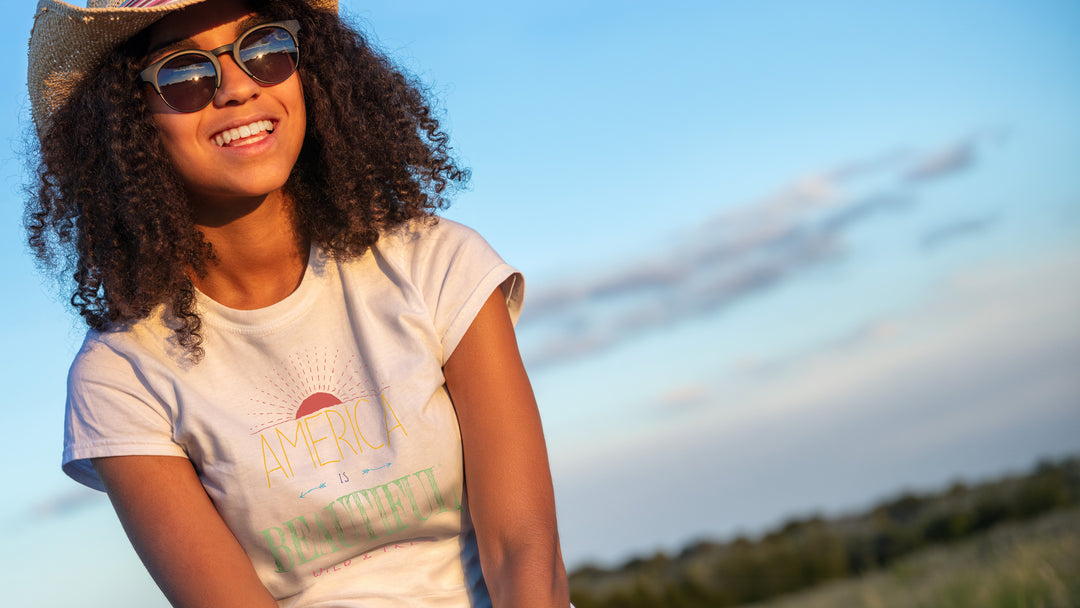 Smiling woman wearing a White t-shirt with &