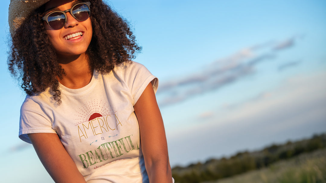 Smiling woman wearing a White t-shirt with &