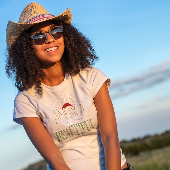 Smiling woman wearing a White t-shirt with &