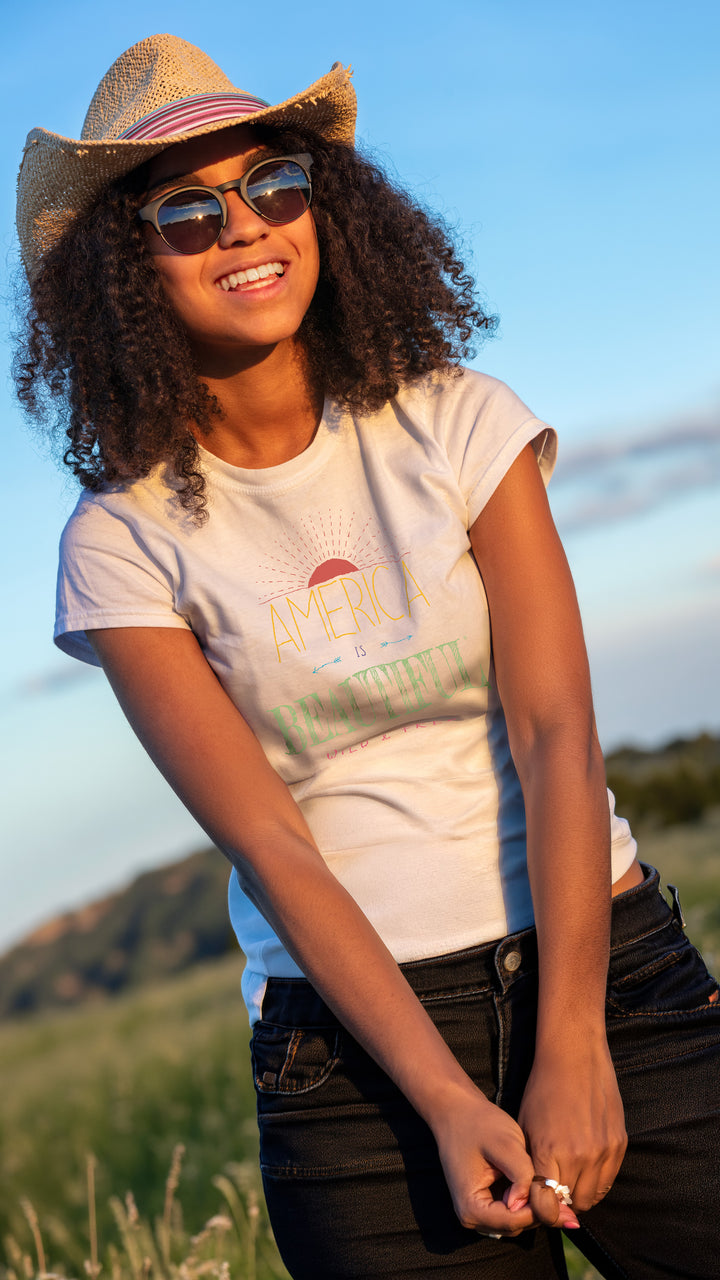 Smiling woman wearing a White t-shirt with &
