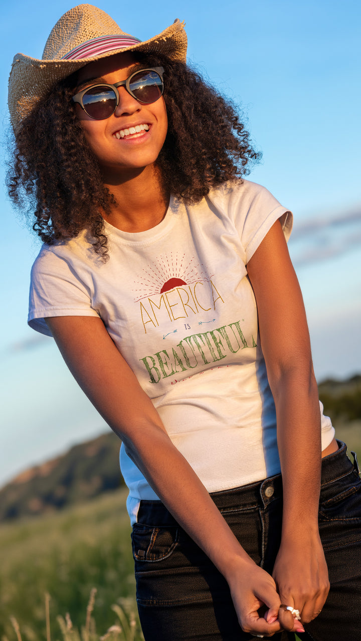 Smiling woman wearing a White t-shirt with &