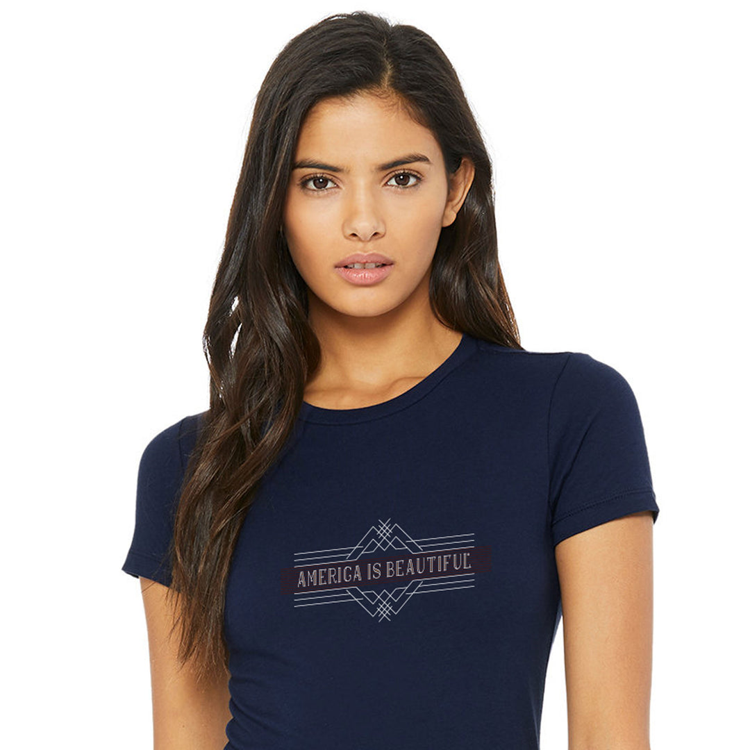 Woman wearing a navy blue t-shirt with 'AMERICA IS BEAUTIFUL' text on a white background