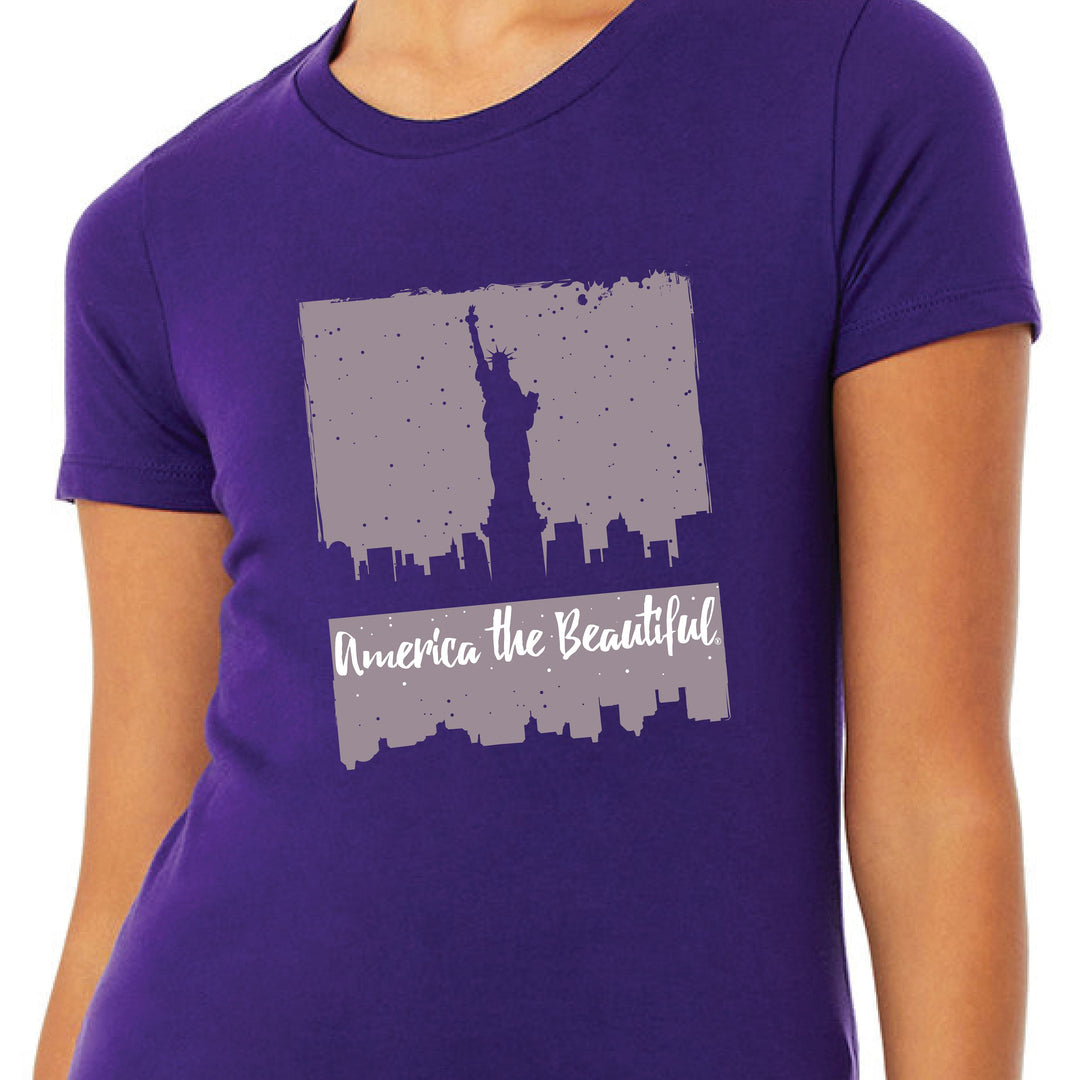 America The Beautiful® Womens Lady Liberty New York Skyline Purple Graphic T-Shirt