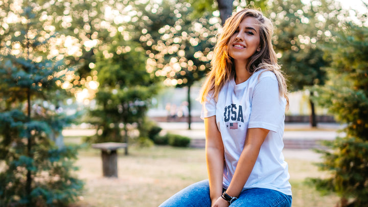 Woman wearing a White t-shirt with &