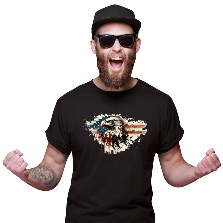 Man wearing a black t-shirt with an eagle and American flag design, sunglasses, and a cap on a white background.