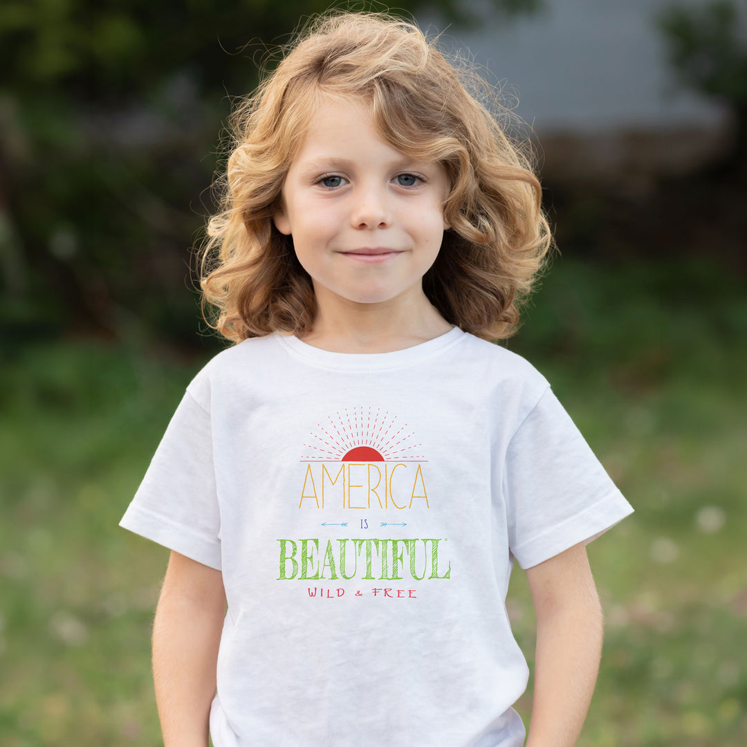Young girl wearing an America Is Beautiful Wild & Free Sunrise Youth T-shirt