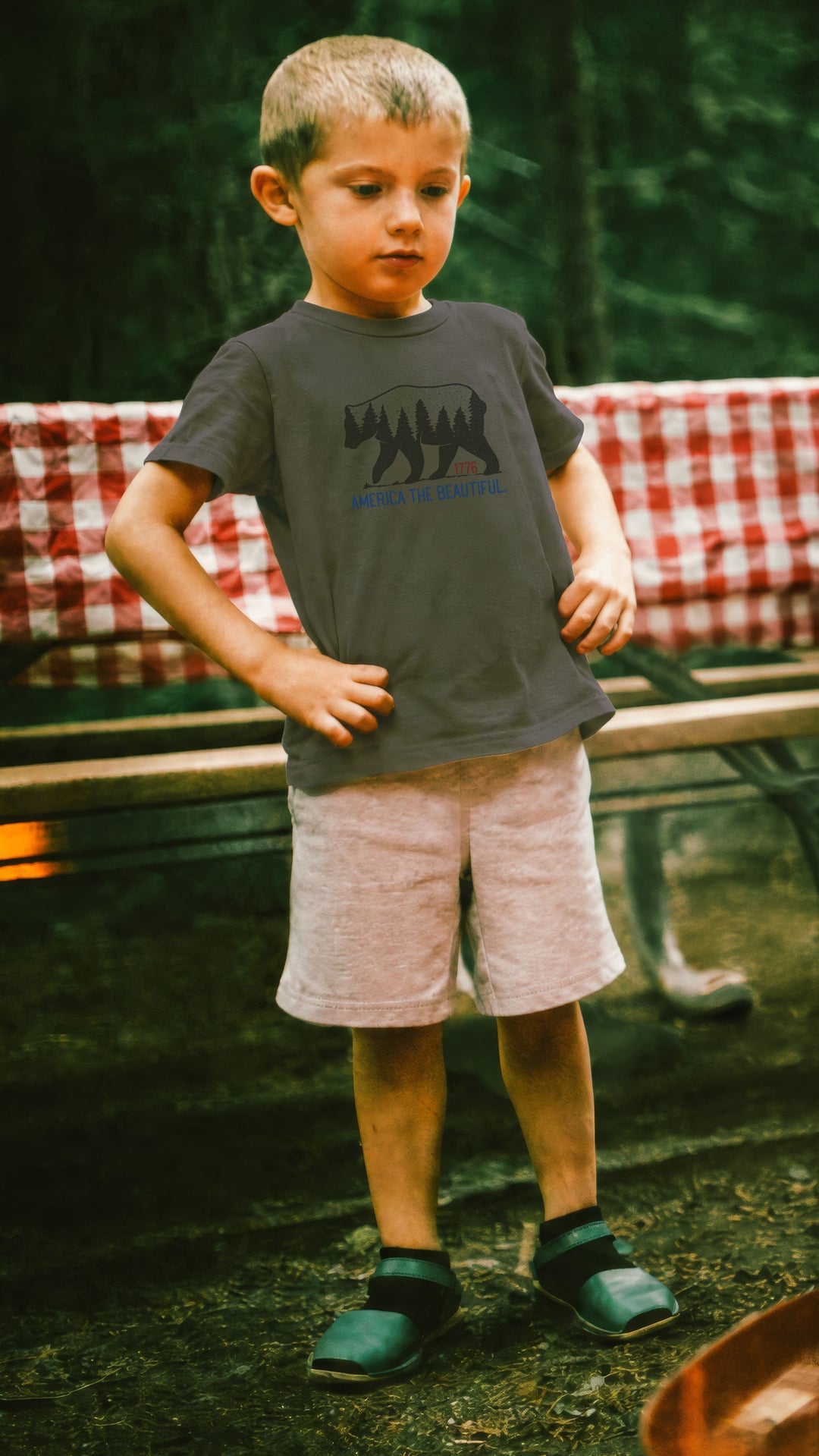 Boy wearing a Military Green t-shirt with bear graphic and &