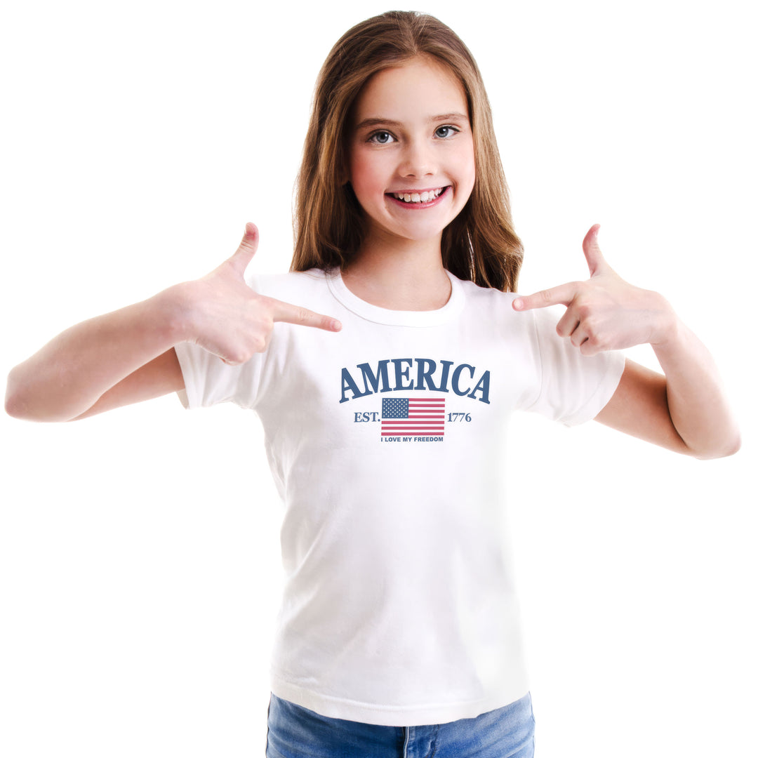 Young girl wearing a white t-shirt with &