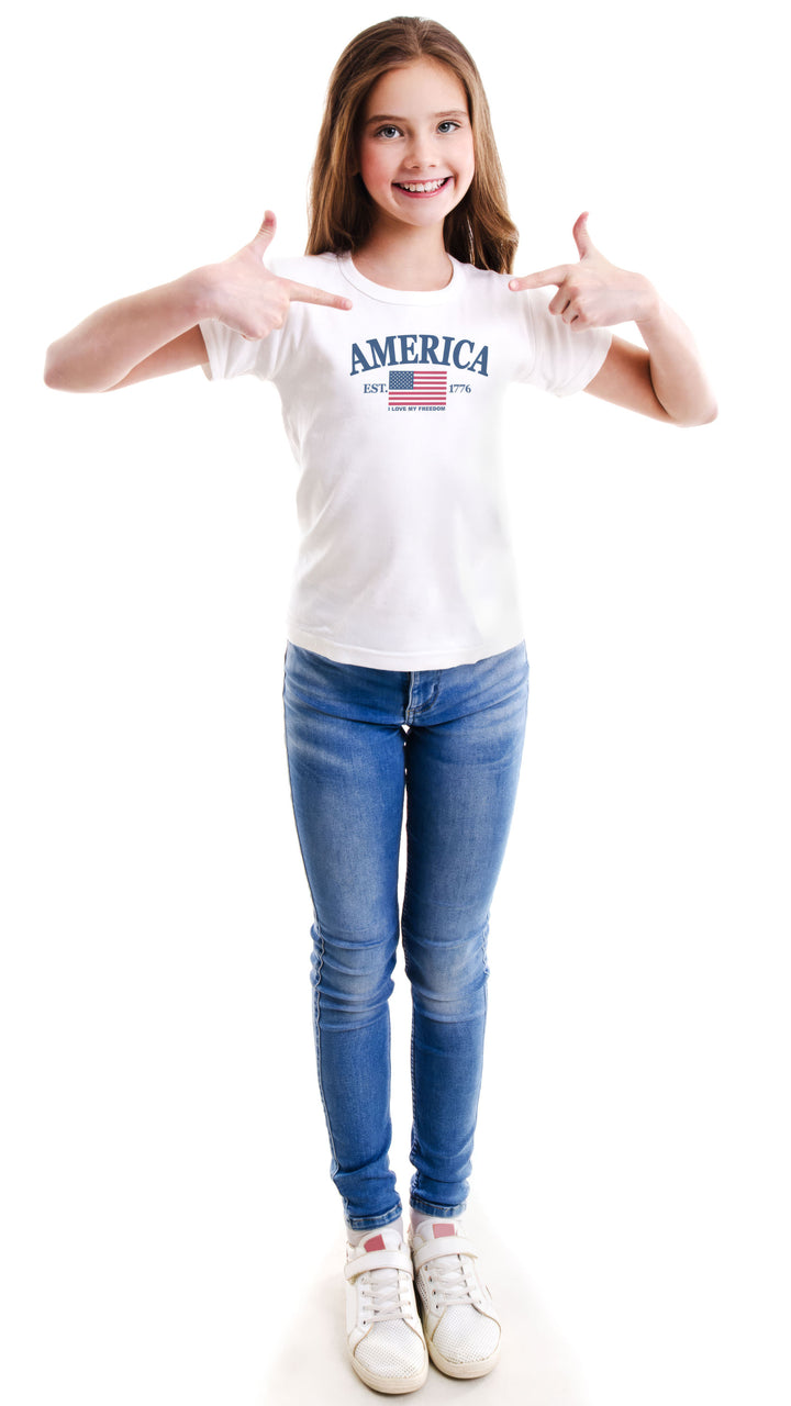 Young girl wearing a white t-shirt with &