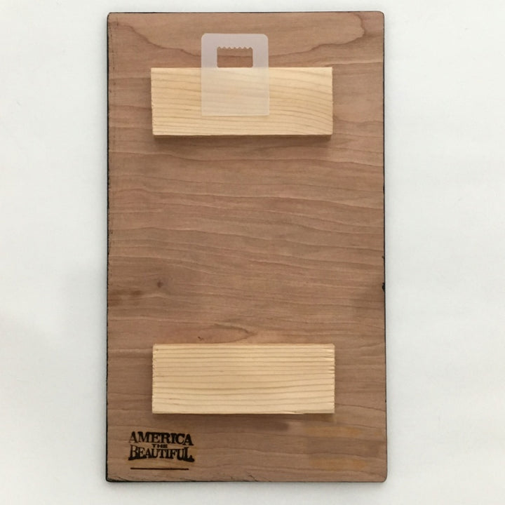 View of back of Yellowstone Old Faithful Wall Decor Plaque by America The Beautiful® with wood struts and hanger tab.