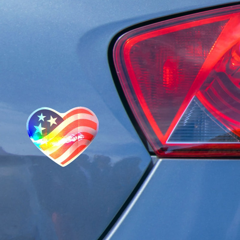 View of Heart Shaped American Flag Sticker Decal on Laser Holographic Foil on a car window.